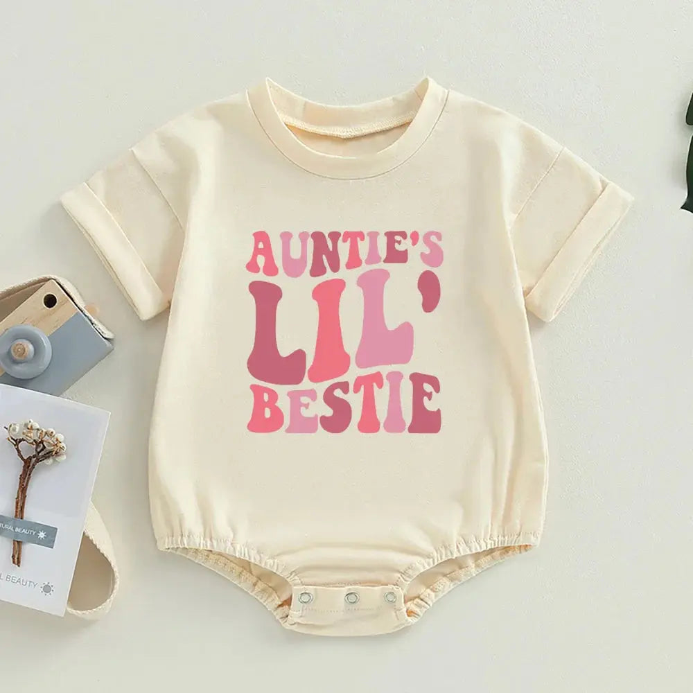 Auntie's Lil Bestie romper displayed, highlighting the fun and trendy text design