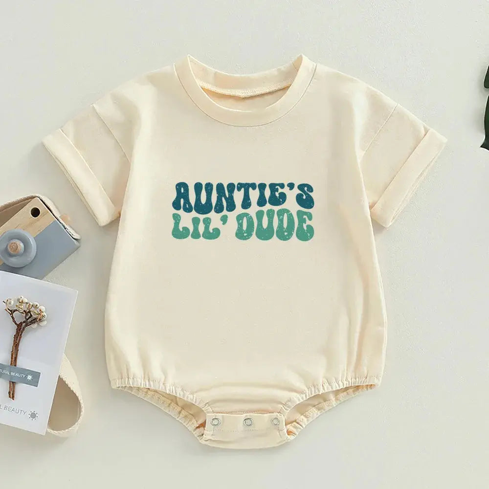 Auntie's Lil Dude romper featuring fun text in a vibrant green font, perfect for little ones